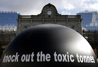 The words "Knock out the toxic tonnes" are seen on a giant ball during a protest by environmental activists in front of the European Parliament in Brussels, Feb. 23, 2015. (Credit: Reuters/Francois Lenoir) Click to Enlarge.