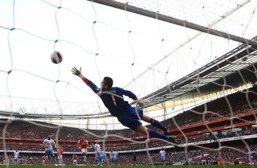 Aston Villa goalkeeper Shay Given fails to stop a free-kick from Arsenal player Mikel Arteta