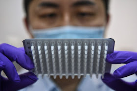 Director Jimmy Toh showing a sample of freeze-dried polymerase chain reaction assays at the BioAcumen Global lyophilisation centre on March 16, 2021.