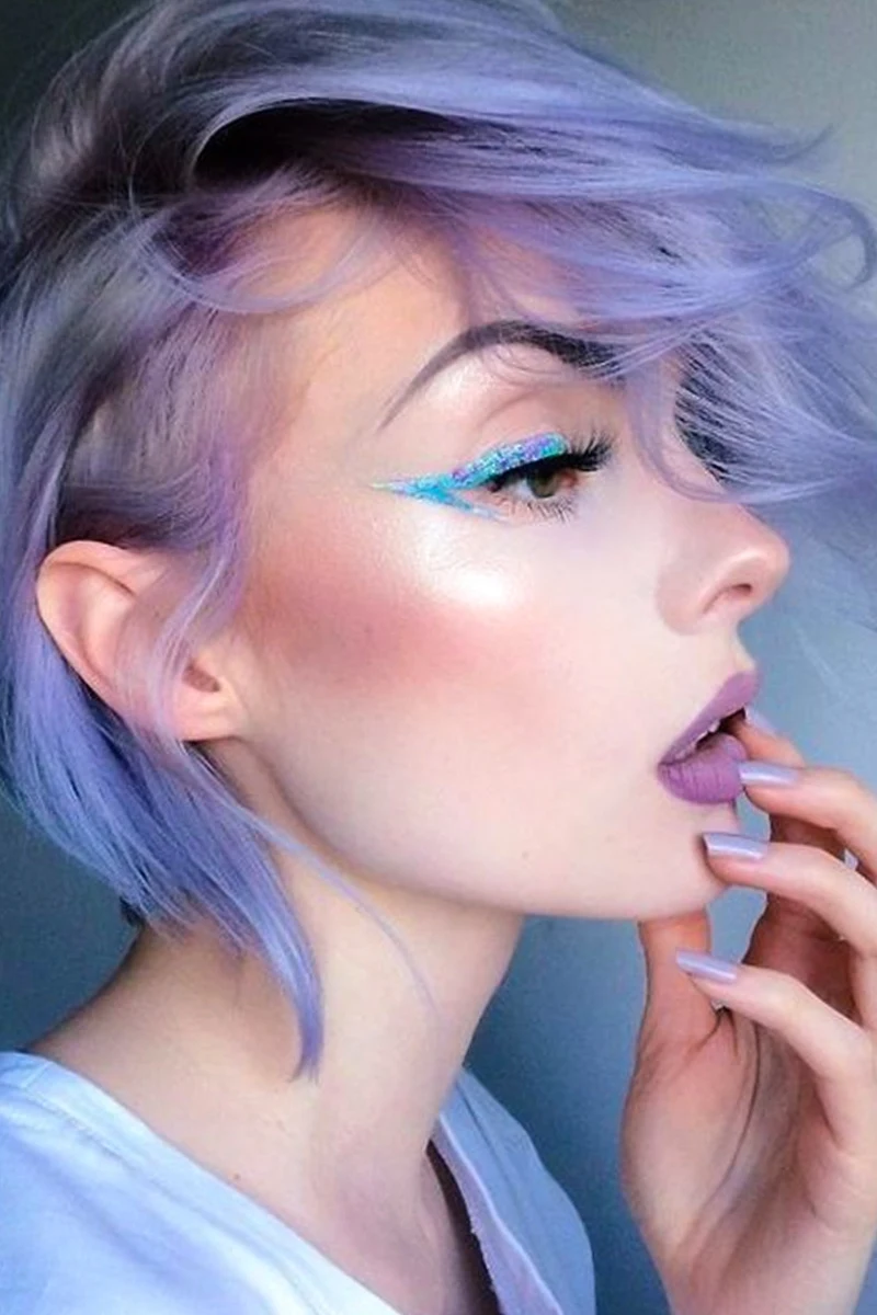 pretty selfie of a young woman with lavender pastel goth makeup