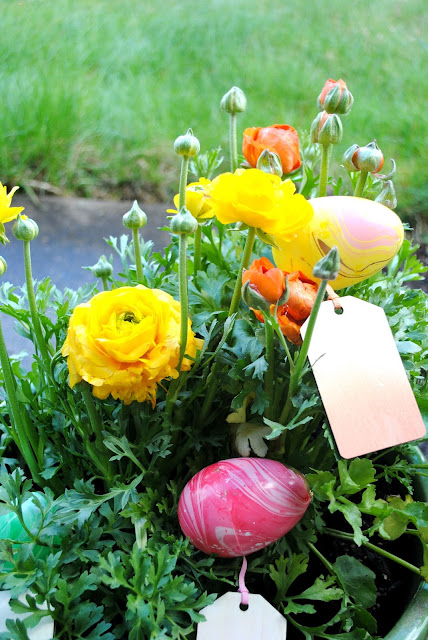 Guests hunt for eggs to find their party favors at an Easter brunch hosted by Fizzy Party 