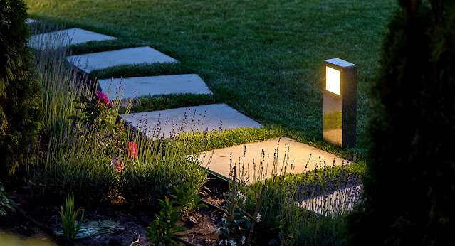 Lighted garden pathway with bollard lights.