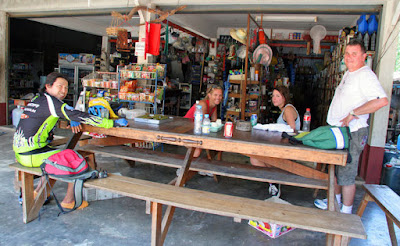 Drinks at the local shop in Koh Yao Noi (my can of Coke, center of table)