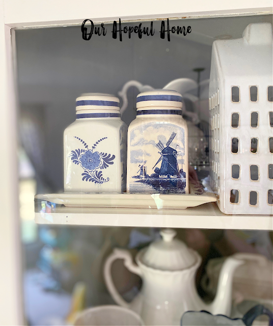 glass door corner cabinet ironstone Delft blue canisters