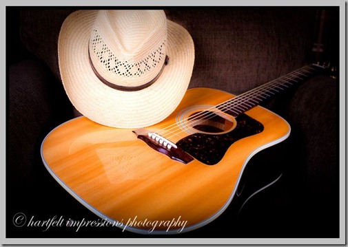 Martin guitar with western hat