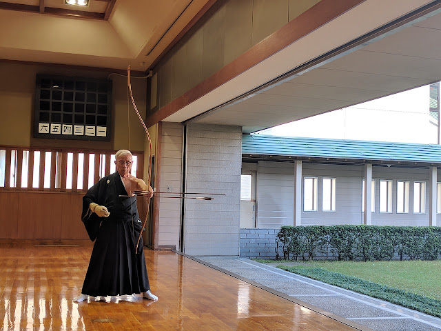 Old Japanese man using bow, Traditional Archery