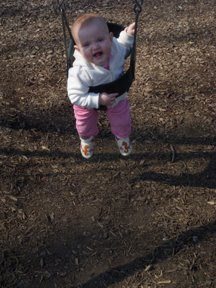 Aria's first ride on a swing