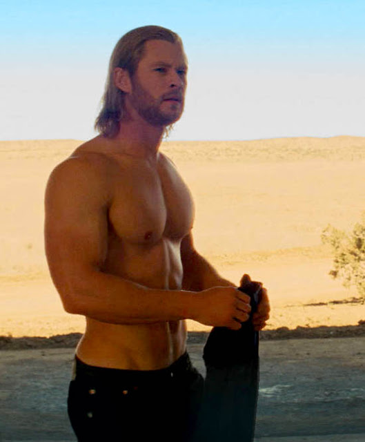 a shirtless Chris Hemsworth as Thor