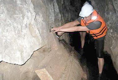 Must get to the bottom of it: Brian trying to lift one of the mining artefacts in the 6th Mile Tunnel.