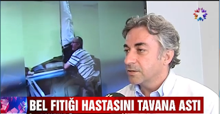 bel fıtığı hastasını tavana asarak tedavi etmeye çalışıyor 