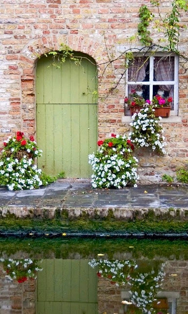 Charming vintage painted door at canal in Bruges - found on Hello Lovely Studio