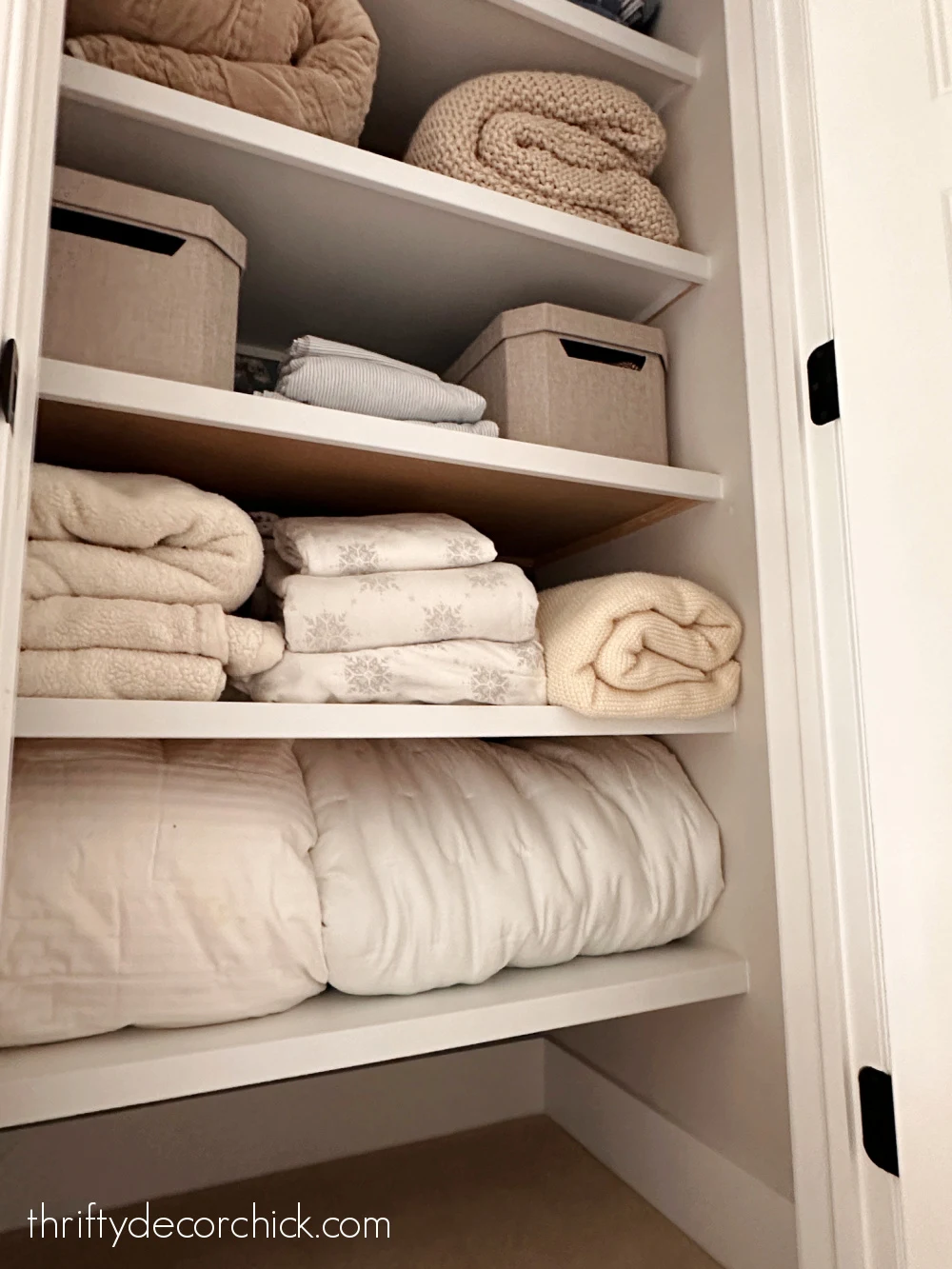 deep wood shelves linen closet