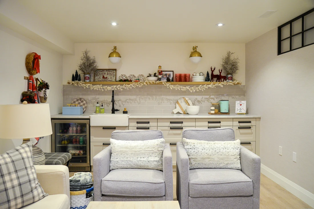 basement kitchenette with floating shelves and christmas decorations
