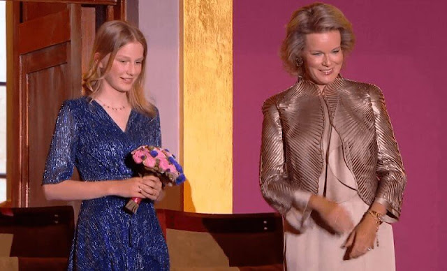 Queen Mathilde wore a new metallic leather applique jacket by Giorgio Armani. Princess Eleonore wore a stretch lurex fabric dress by Maje