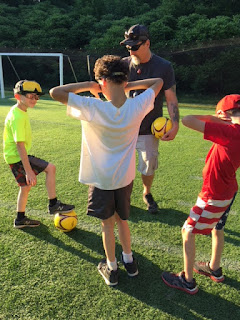 James Howard from DBVI teaching students soccer.