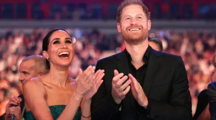 Meghan Markle (L) and Prince Harry (R)