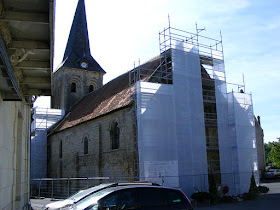 The church at La Celle Guenand under scaffolding for restoration.  Indre et Loire, France. Photographed by Susan Walter. Tour the Loire Valley with a classic car and a private guide.