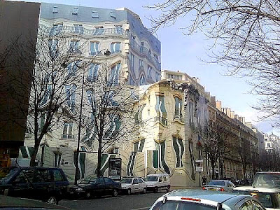 This surreal building actually exists at 39 Avenue George V, Paris.