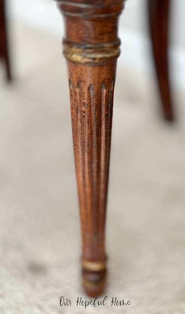 carved gilded round turned chair leg