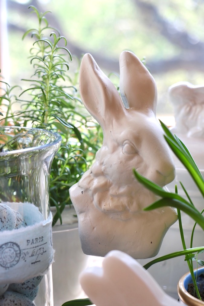 A French hare keeps watch over a Spring Blue and White Basket Arrangement
