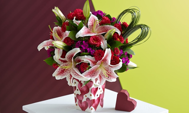 pictures of valentine flowers red rose mix with other flowers in green toush with white