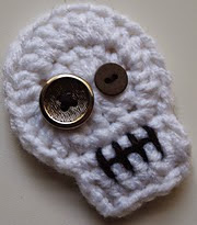 http://www.ravelry.com/patterns/library/spooktacular-sugar-skull-applique