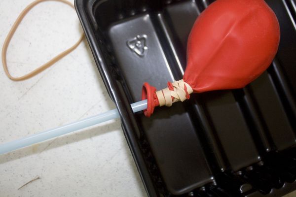 Insert Straw with Balloon inside boat