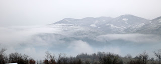 Snow on top of the hills across the valley