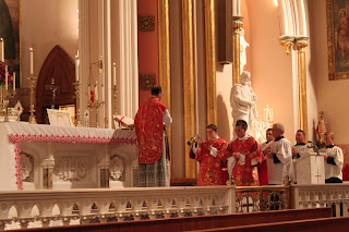 Censing the celebrant during the Introit.