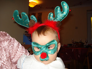 Baby Boy with Reindeer Mask and Antlers