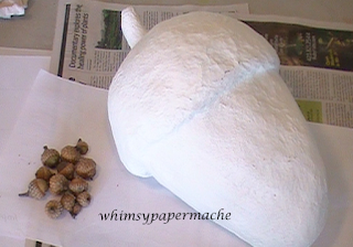 Paper Mache and Paper Clay Acorn with primer coat of paint