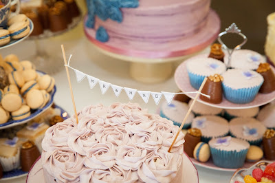 Wedding cake table with walnut whips, fondant fancies, carrot cake and macaroons 