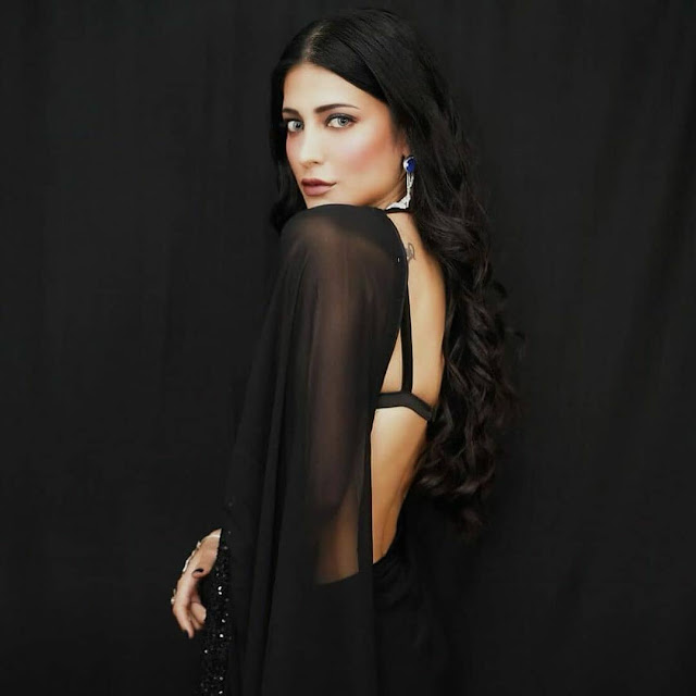 Shruthi Hassan exudes elegance in a stunning black sleeveless saree.