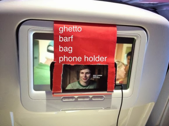 How to watch your own videos on a plane: barf bag