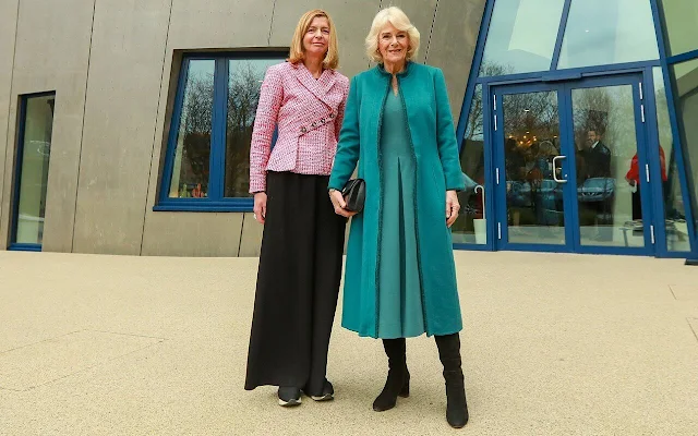 Queen Camilla wore a blue grey midi dress by Fiona Clare, and a blue coat. NHS Foundation Trust the Royal Free Hospital
