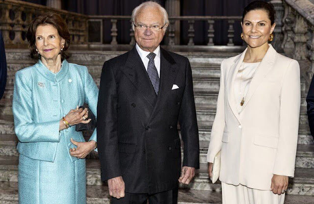Andiata silk top. Crown Princess Victoria wore a cream blazer, jacket and cream trousers by Andiata. Queen Silvia wore a light blue jacket