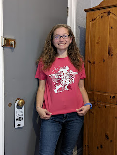 Me wearing the pink Yorkshire Marathon finishers top.