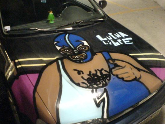 Graffiti On The Hood Of a Honda Car