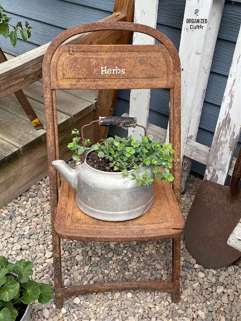 Photo of a stenciled rusty folding garden chair.