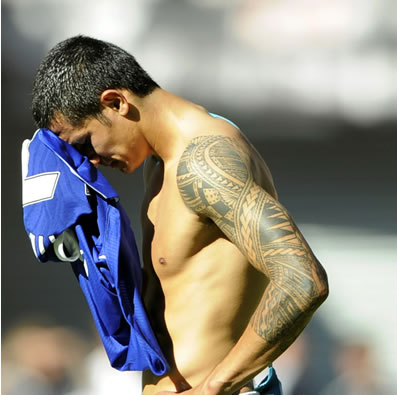 We love Tim Cahill's tattoo And we're kind of entranced with Tim Cahill too