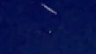 White Cylinder Shape UFO with Orbs flying around it Arizona.