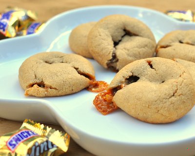 Snickers Cookies ♥ KitchenParade.com. Peanut butter cookie dough baked around a mini Snickers bars. Rave Reviews!