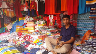 A clothing vendor. Not very busy on a Friday