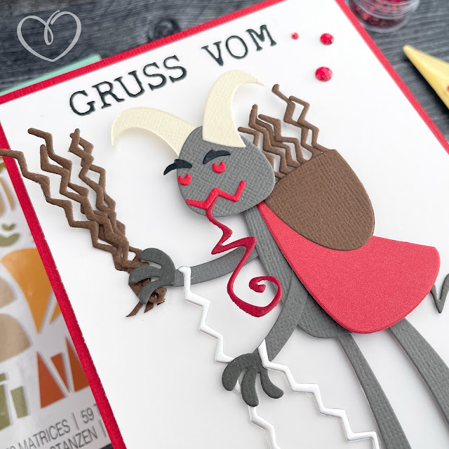 Card with Krampus made of Sizzix die cuts and cardstock with the sentiment "Gruss vom Krampus," or "Greetings from Krampus."