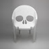 White Fiberglass Skull Chair By Pool.