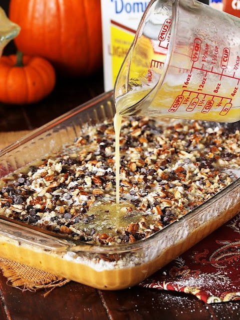 Pouring Butter to Make Chocolate Chip Pumpkin Dump Cake Image