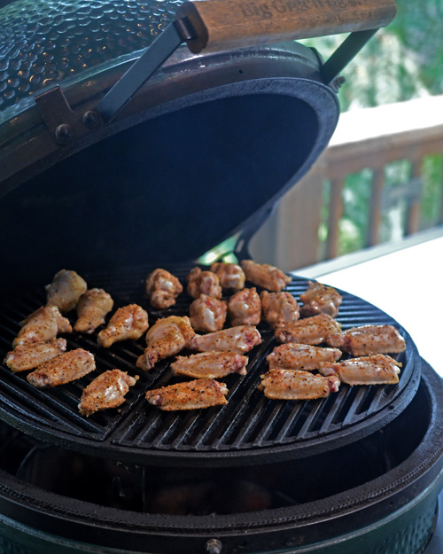 Cooking wings raised direct on a large Big Green Egg