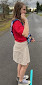 Young woman standing on a line a preparing to throw a cotton ball like a shot put.