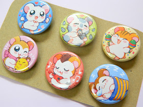 A set of 6 button badges showing characters from an anime, Hamtaro