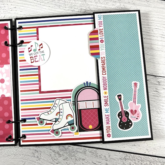 Our Love Story scrapbook album page with roller skates, guitars, and a jukebox